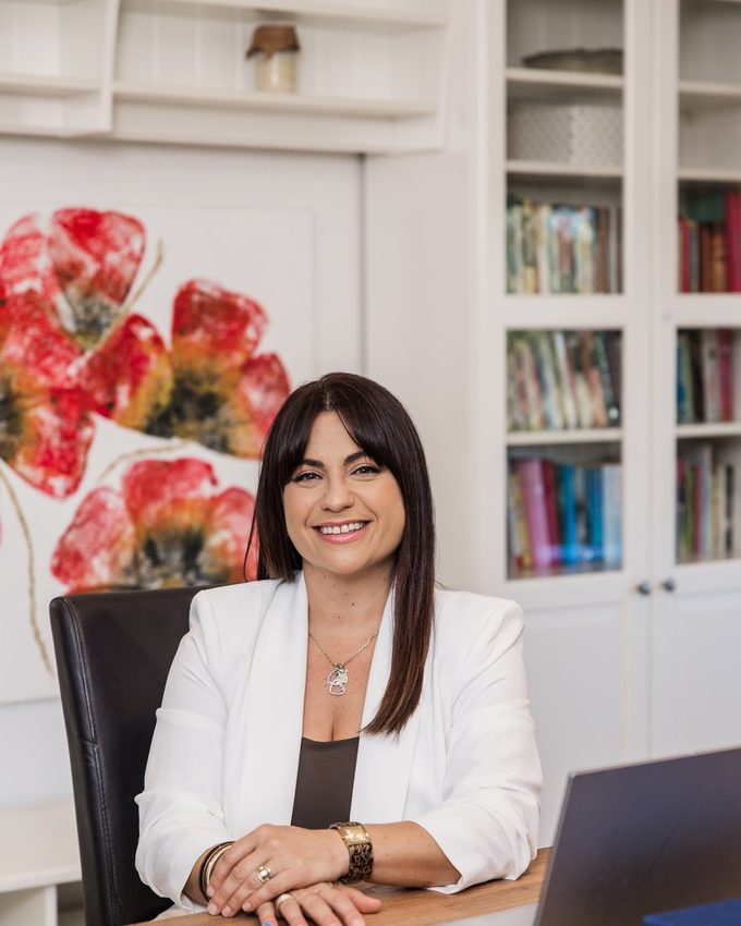 Nikoletta sitting at her desk